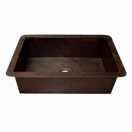 Front view of a custom drop-in undermount single bowl copper kitchen sink