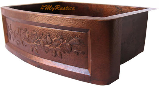 apron detail view of a sink for a kitchen made of hammered copper