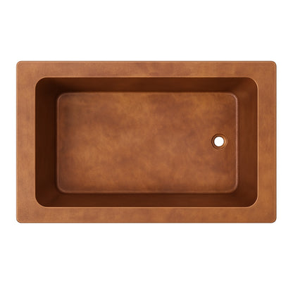 Alcove drop-in copper bathtub closeup view, view from above