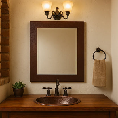 Bathroom with a custom hand-hammered rectangular copper mirror
