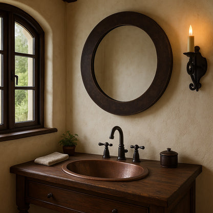 Bathroom with a custom hand-hammered round copper mirror