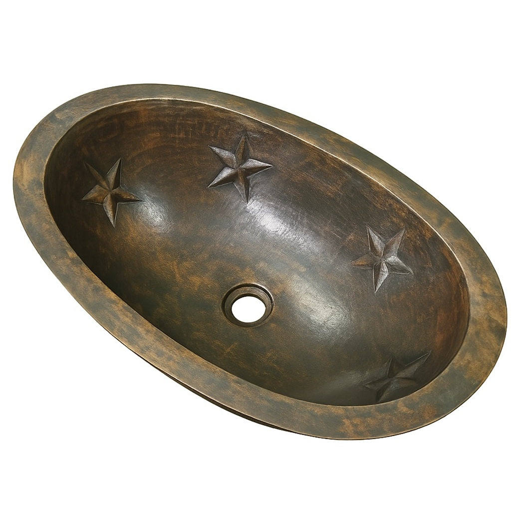 Angled view of custom oval copper bathroom sink with embossed Texas star motifs and smooth rim