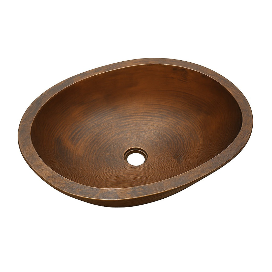 Side view of a custom oval drop in undermount copper bathroom sink