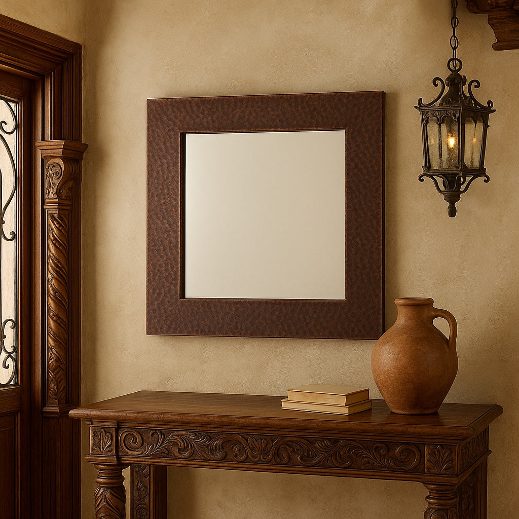 Old European style house entry with a custom square copper mirror with round center opening next to the door