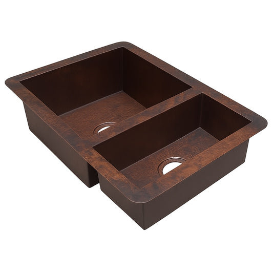Side view of a custom drop in undermount copper kitchen sink with larger left bowl