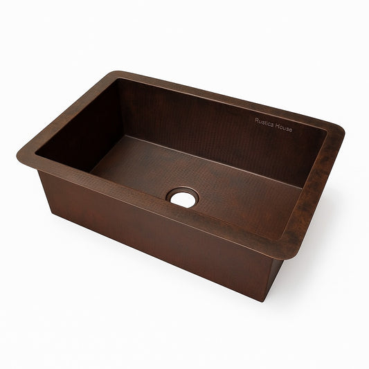 Side view of a custom drop-in undermount single bowl copper kitchen sink