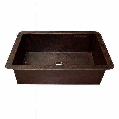 Front view of a custom drop-in undermount single bowl copper kitchen sink