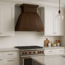Hacienda copper range hood with grapevine apron design in a Transitional style kitchen