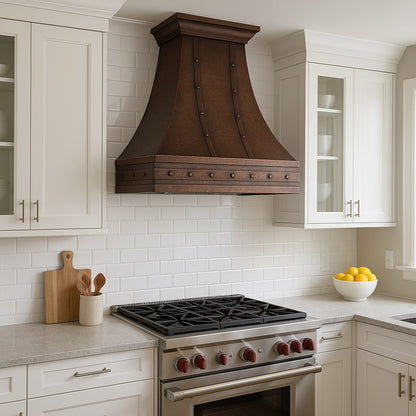 Transitional style kitchen with a Hacienda copper range hood with rivets and straps design