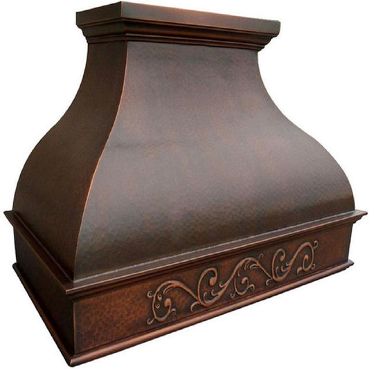 Hammered copper range hood with decorative scrollwork apron detailed view of the apron scroll
