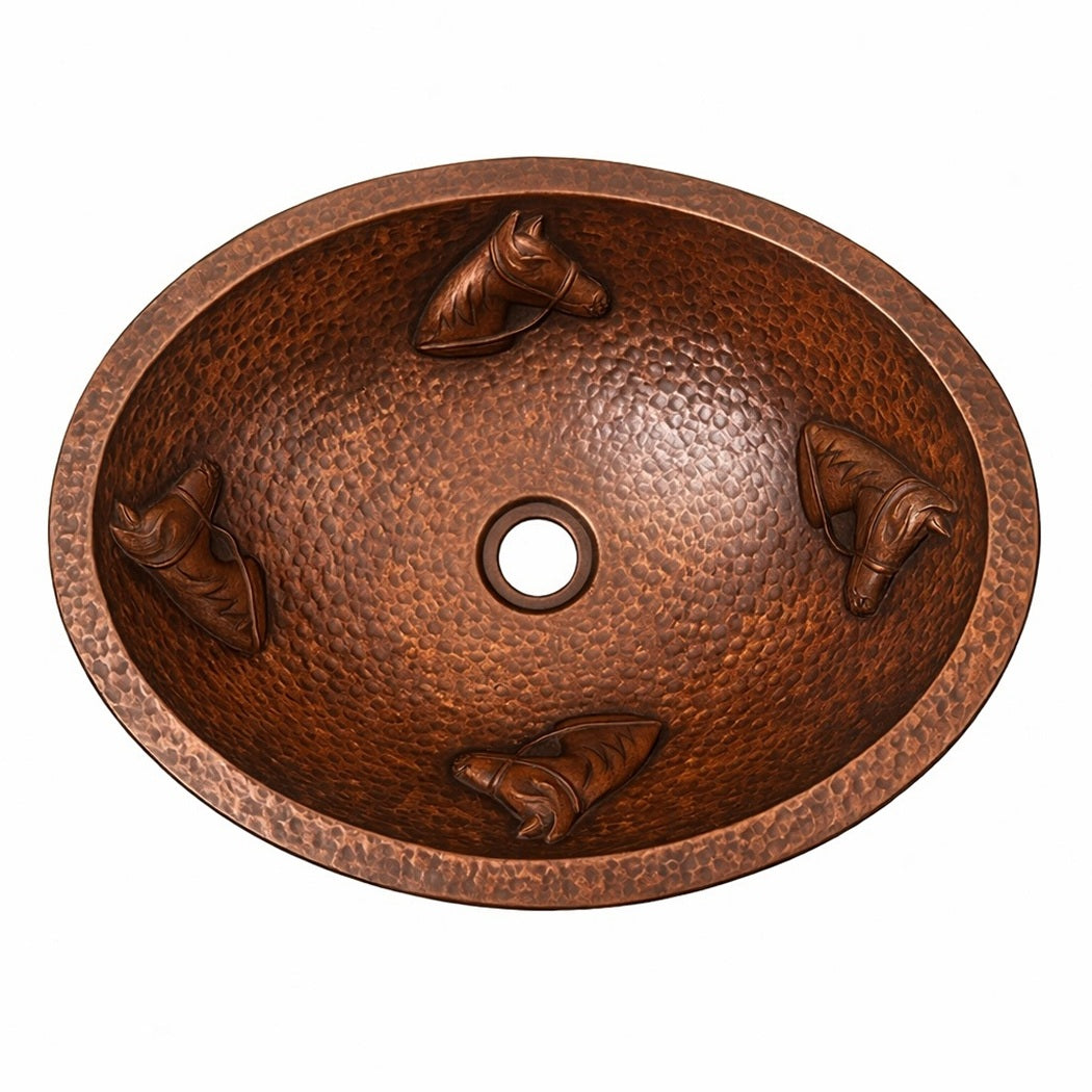 Custom hammered oval copper drop in bathroom sink with horse head reliefs