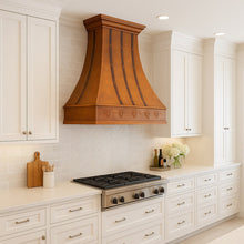 Custom farmhouse copper hood with grapevine in a contemporary style kitchen