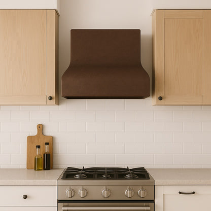 Minimalist curved copper range hood with smooth patina finish in a modern European style kitchen setting