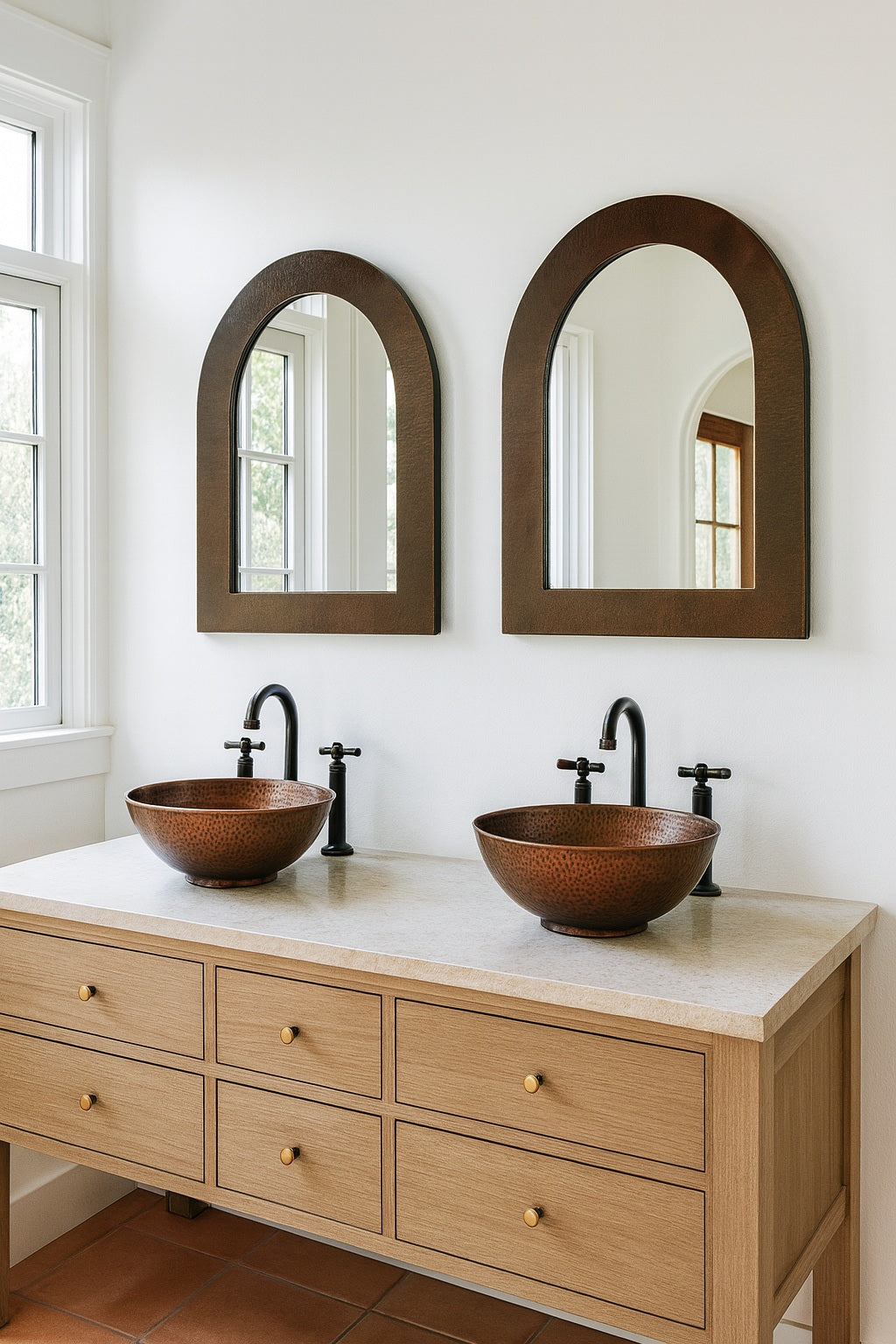 Custom hand-hammered arched copper mirror in a powder room