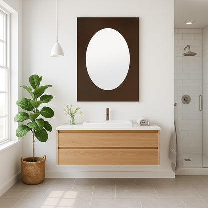Custom rectangular copper mirror with oval center in a Scandinavian style bathroom