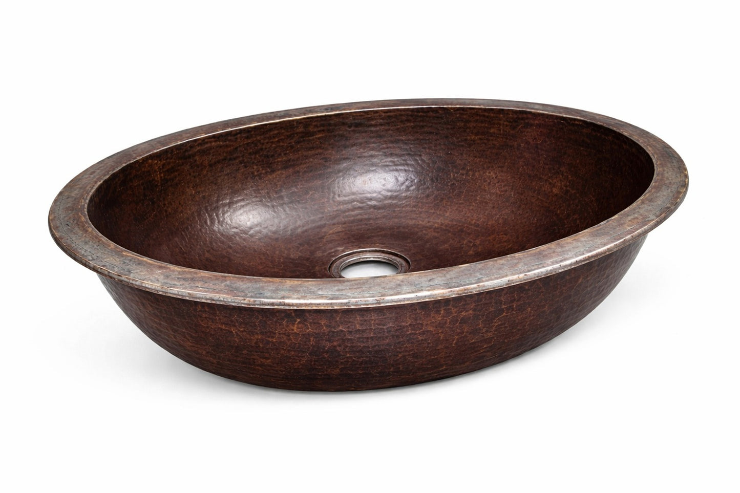 Angled view of a small oval copper bathroom sink with hammered finish