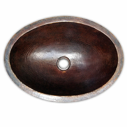 Small oval custom copper bathroom sink with hammered finish