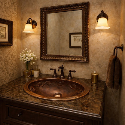 Small oval hammered copper drop-in bathroom sink with decorative relief in a powder room