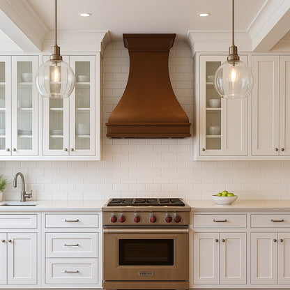 Smooth bell-shaped copper range hood with flared crown design in transitional style kitchen