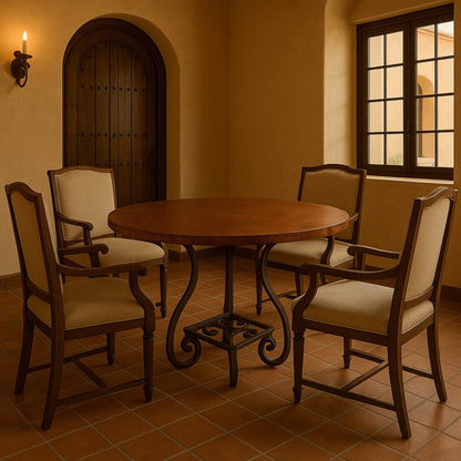Round copper table with four chairs in a Spanish mission style dining room with tiled floor and arched door.