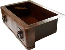 side view of a classic apron copper sink for a kitchen